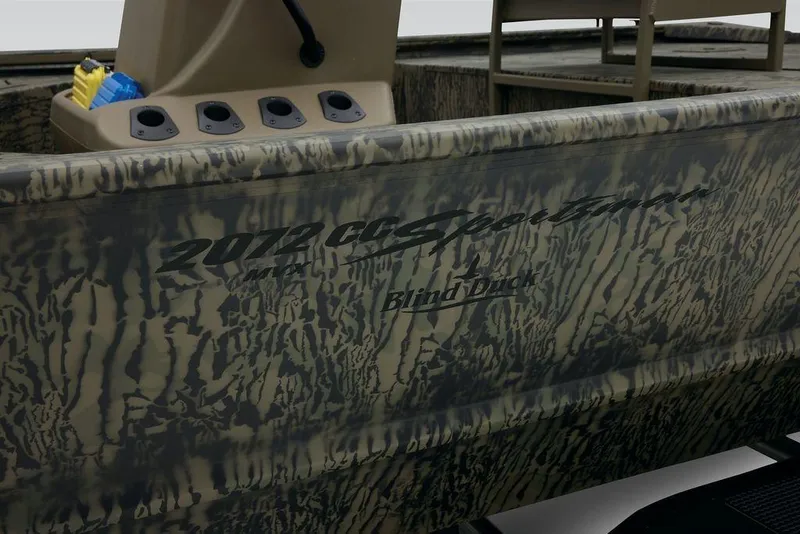 Slide: The Image of 2026 Tracker GRIZZLY® 2072 CC Sportsman boat with camouflage design and console details. - 11