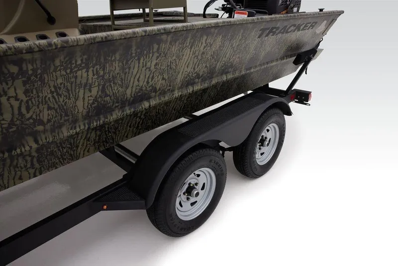 Slide: The Image of 2026 Tracker GRIZZLY® 2072 CC Sportsman boat on trailer, featuring camouflage design. - 12