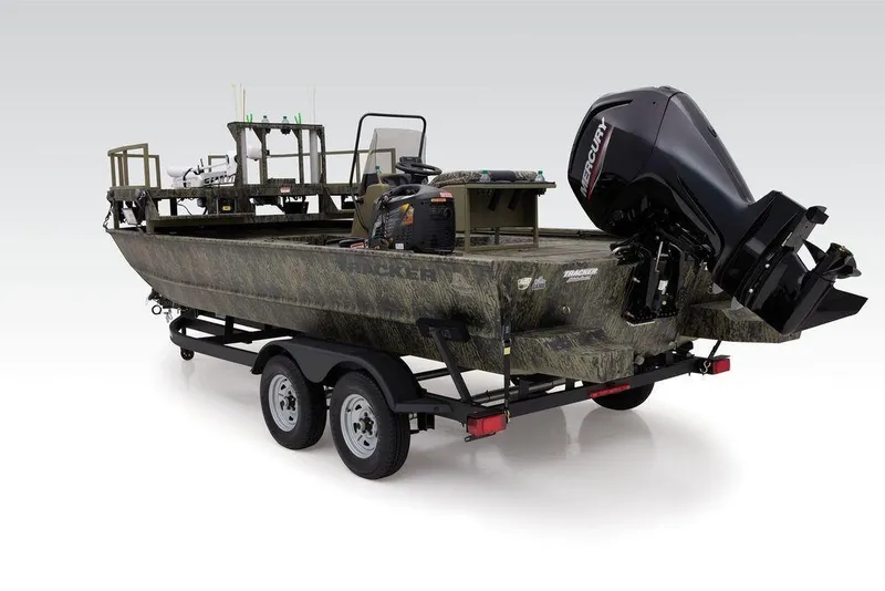 Slide: The Image of 2026 Tracker GRIZZLY® 2072 CC Sportsman boat on trailer, featuring camouflage design and Mercury outboard motor. - 13