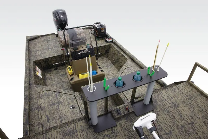 Slide: The Image of 2026 Tracker GRIZZLY® 2072 CC Sportsman boat interior with fishing gear and motor. - 19