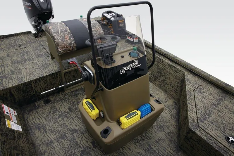 Slide: The Image of 2026 Tracker GRIZZLY® 2072 CC Sportsman boat interior with camouflage design and control console. - 20