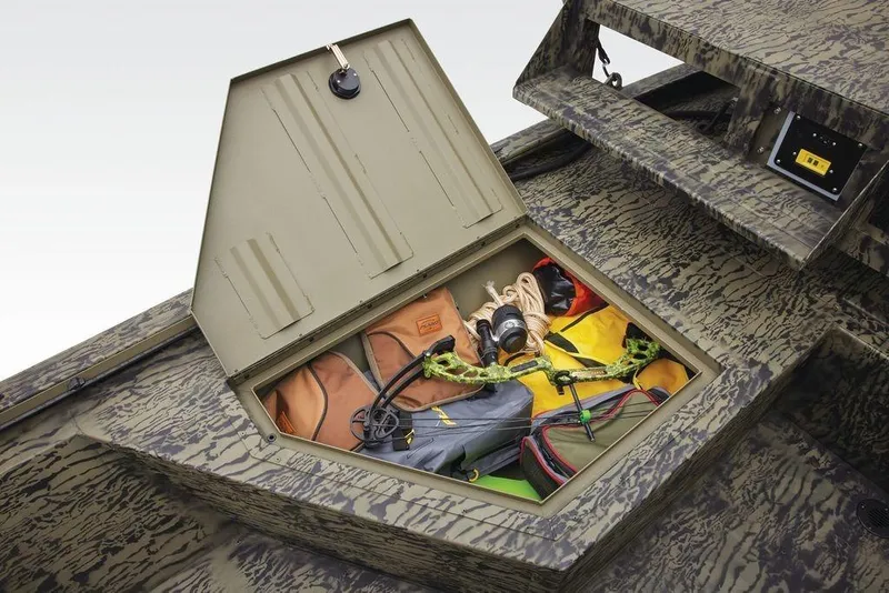 Slide: The Image of Open storage compartment in 2026 Tracker GRIZZLY® 2072 CC Sportsman boat, holding gear and equipment. - 24