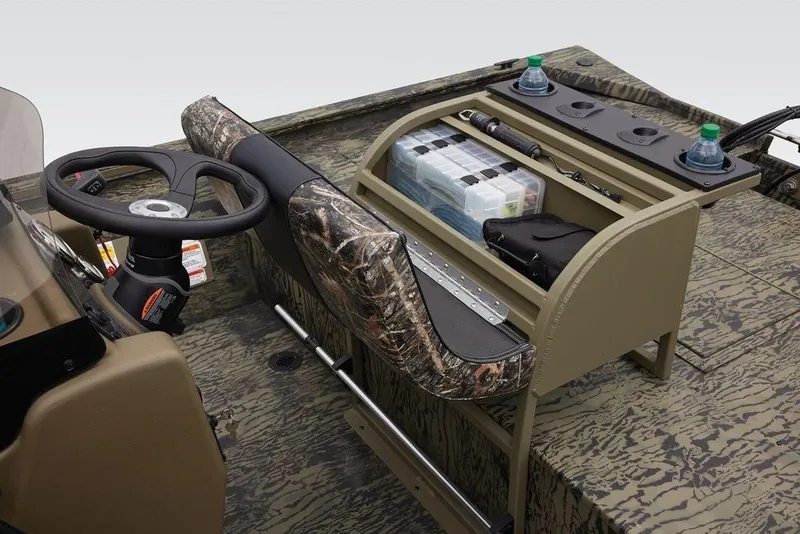 Slide: The Image of 2026 Tracker GRIZZLY® 2072 CC Sportsman boat interior with camo design and organized storage. - 31