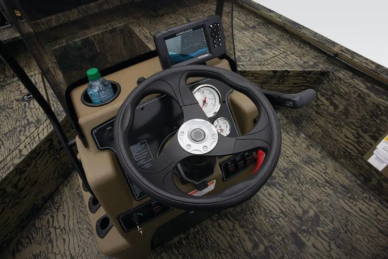 Slide: The Image of Steering console of 2026 Tracker GRIZZLY® 2072 CC Sportsman boat with gauges and navigation system. - 34