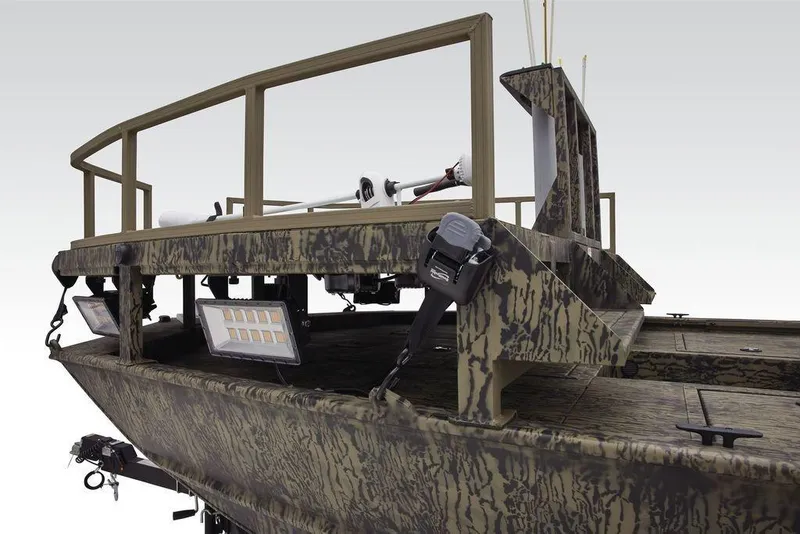 Slide: The Image of 2026 Tracker GRIZZLY® 2072 CC Sportsman boat with camouflage design and mounted lights. - 8