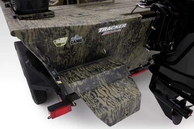 Slide: The Image of 2026 Tracker GRIZZLY® 2072 CC Sportsman boat with camo design and Sure Tread surface. - 9
