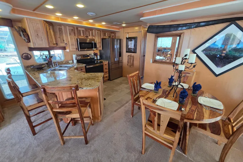 Slide: The Image of Luxurious 2015 Sailabration 64 interior with modern kitchen and elegant dining area. - 15