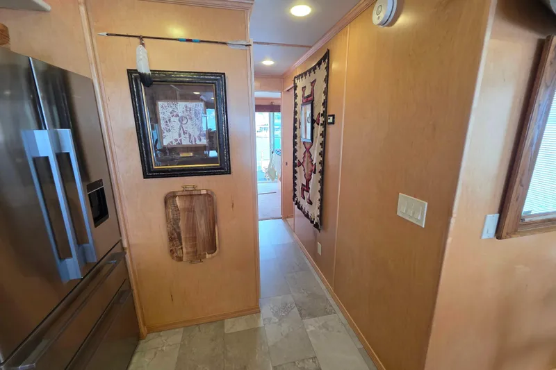 Slide: The Image of Hallway in 2015 Sailabration 64 houseboat with artwork and modern decor. - 24