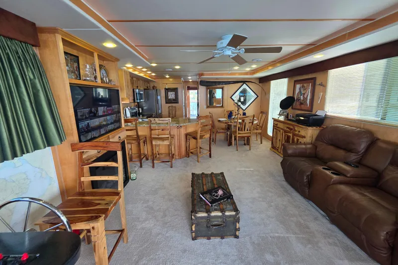 Slide: The Image of Luxurious 2015 Sailabration 64 yacht interior with cozy seating, dining area, and entertainment setup. - 3