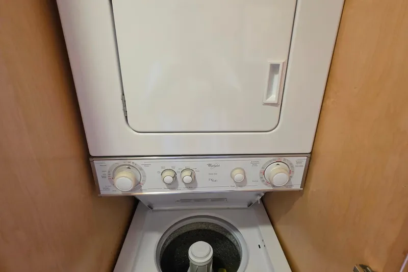 Slide: The Image of Stacked washer and dryer unit in 2015 Sailabration 64 boat interior. - 41
