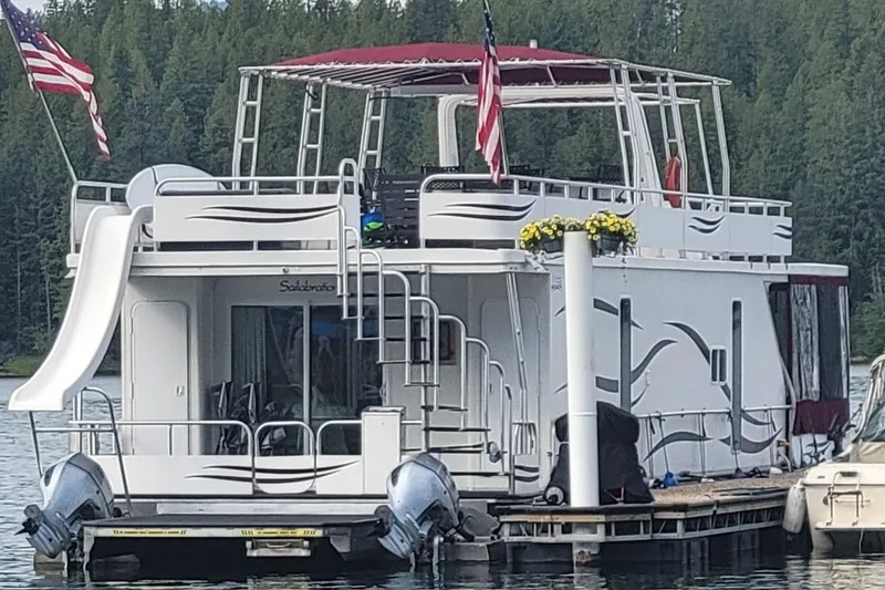 Slide: The Image of Houseboat on lake with slide, flags, and canopy, Sailabration 64, 2015 model. - 46