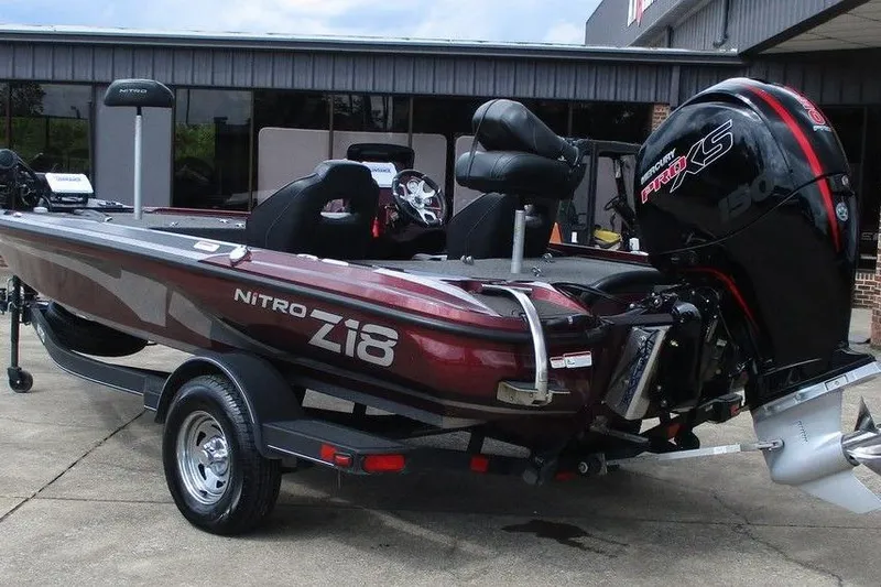 Slide: The Image of 2023 Nitro Z18 boat with Mercury Pro XS engine, parked on a trailer. - 2