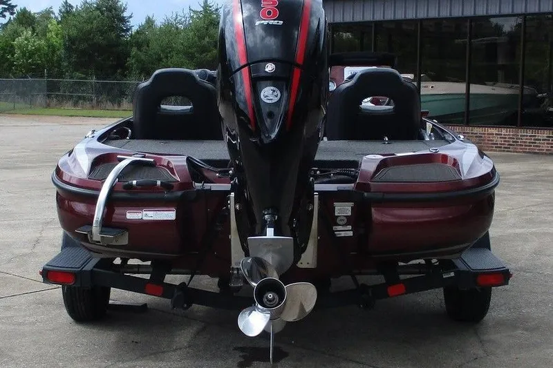Slide: The Image of 2023 Nitro Z18 boat with powerful outboard motor, parked on a trailer. - 3