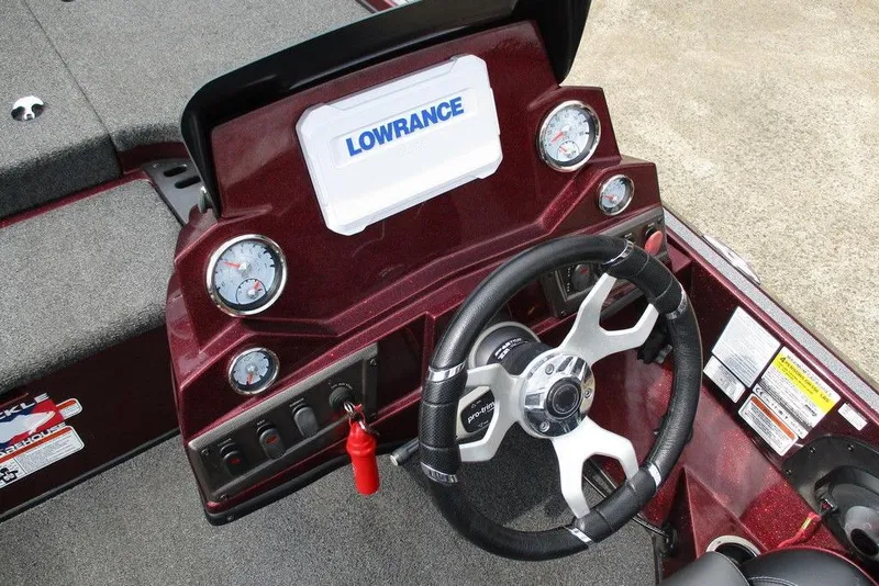 Slide: The Image of 2023 Nitro Z18 boat dashboard with steering wheel and Lowrance display. - 4