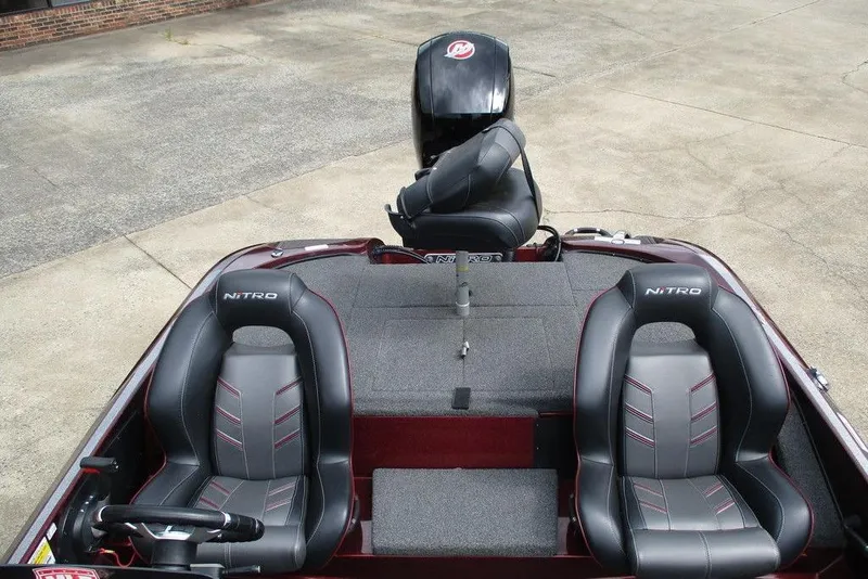 Slide: The Image of 2023 Nitro Z18 boat interior with dual seats and motor, showcasing sleek design. - 6