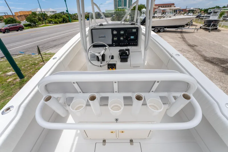 Slide: The Image of Center console of a 2004 Jupiter 27fs boat with rod holders and navigation equipment. - 15