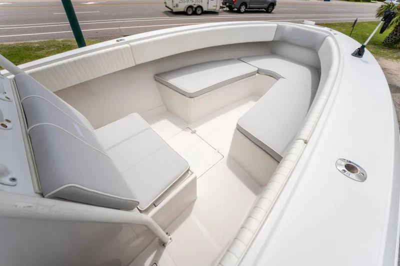 Slide: The Image of 2004 Jupiter 27fs boat interior with cushioned seating and spacious layout. - 21