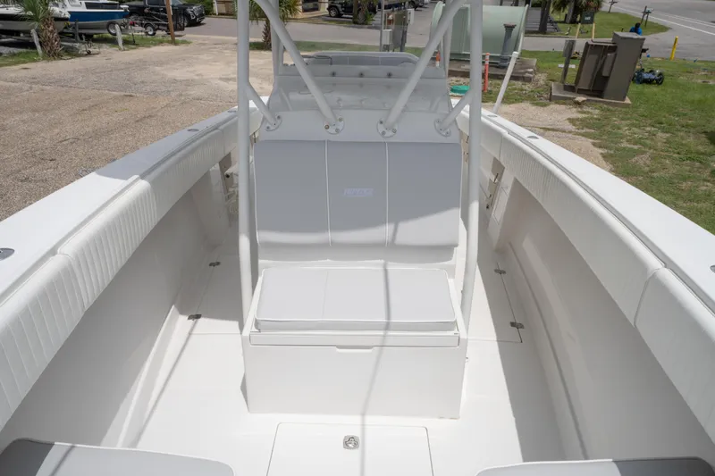 Slide: The Image of 2004 Jupiter 27fs boat interior with white seating and open deck. - 24