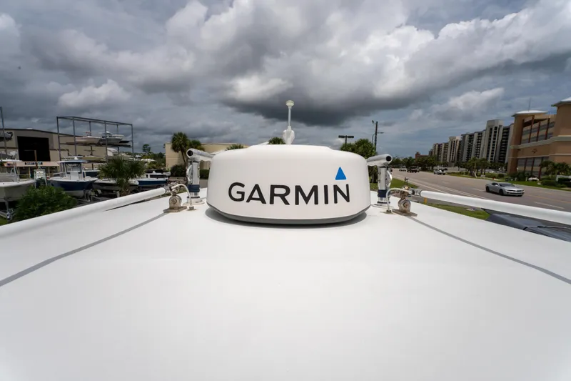Slide: The Image of Garmin radar on 2004 Jupiter 27fs boat under cloudy sky. - 26