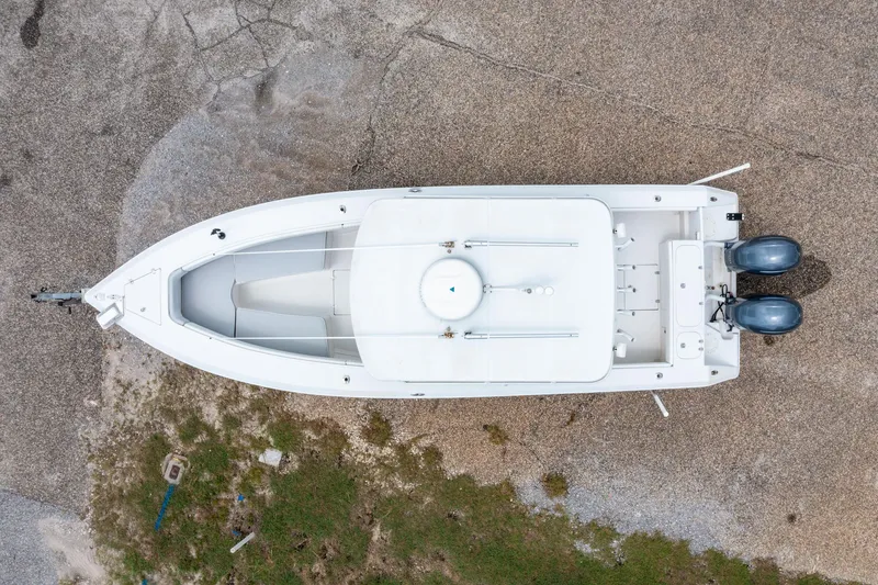 Slide: The Image of Aerial view of 2004 Jupiter 27fs boat on gravel surface. - 3