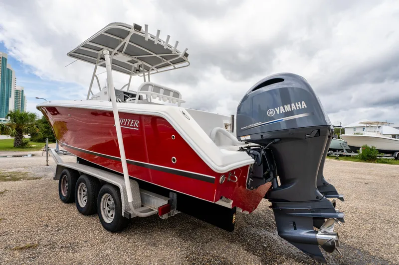 Slide: The Image of Red 2004 Jupiter 27fs boat with Yamaha outboard motor on a trailer. - 8