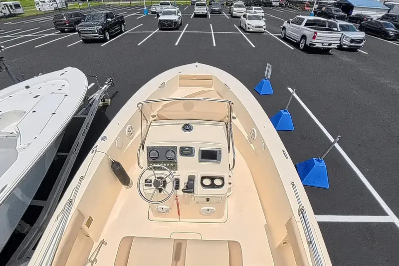 Slide: The Image of 2014 Scout 195 Sportfish boat in parking lot, view of helm and controls. - 4