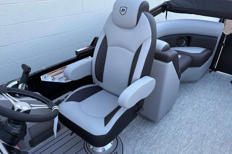 Slide: The Image of 2026 Premier 210 Sunsation RF boat interior with luxurious seating and modern steering wheel. - 10