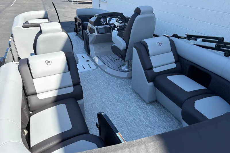 Slide: The Image of Interior of 2026 Premier 210 Sunsation RF pontoon boat with luxurious seating and modern helm. - 3