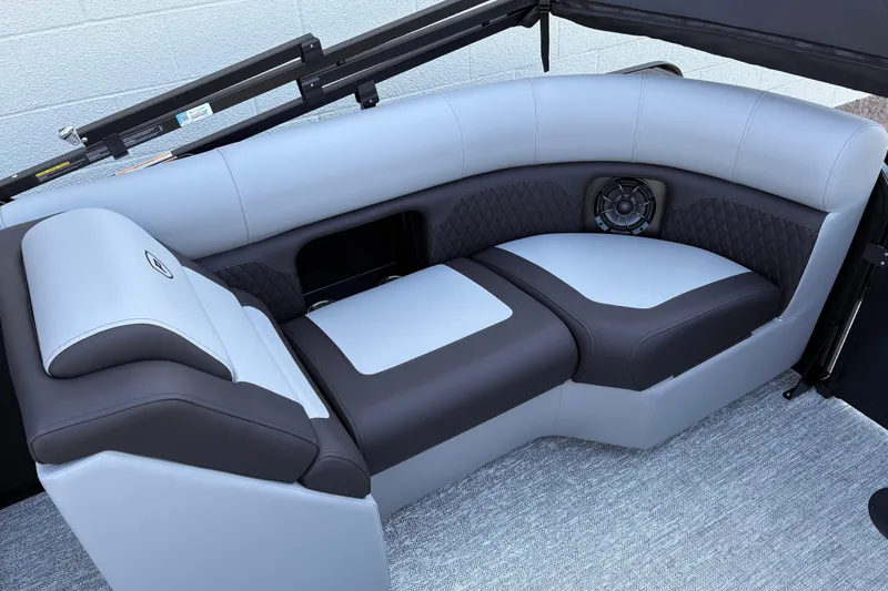 Slide: The Image of Luxurious seating on 2026 Premier 210 Sunsation RF boat, featuring sleek design and integrated speaker. - 5