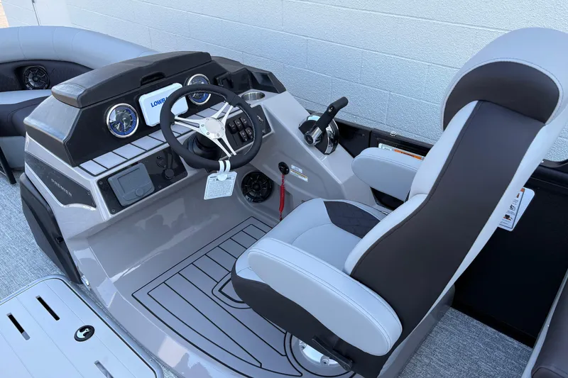Slide: The Image of 2026 Premier 210 Sunsation RF boat cockpit with modern steering and controls. - 8