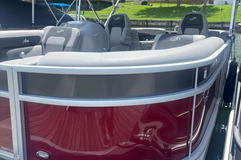Slide: The Image of 2025 Barletta ARIA 22QC pontoon boat with sleek red exterior and comfortable seating. - 1