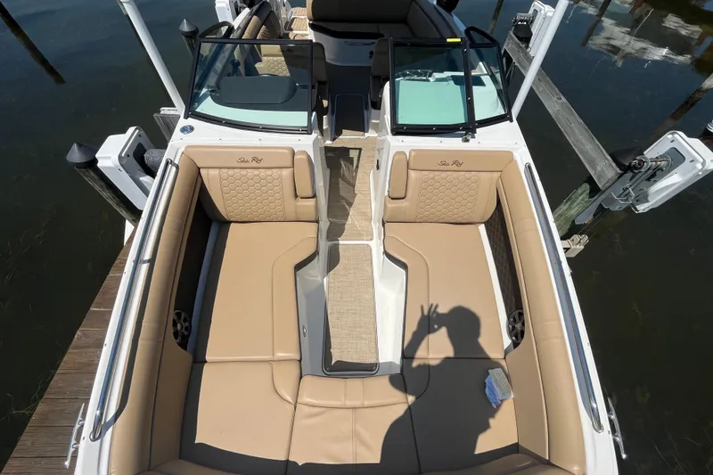Slide: The Image of 2021 Sea Ray SDX 270 Outboard boat with tan seating and open deck layout. - 23