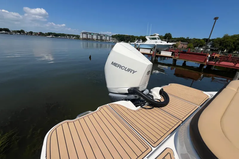 Slide: The Image of 2021 Sea Ray SDX 270 Outboard with Mercury engine on a calm lake. - 3