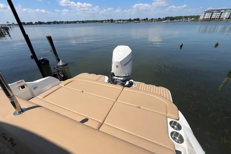 Slide: The Image of 2021 Sea Ray SDX 270 Outboard boat on calm lake with clear sky. - 5