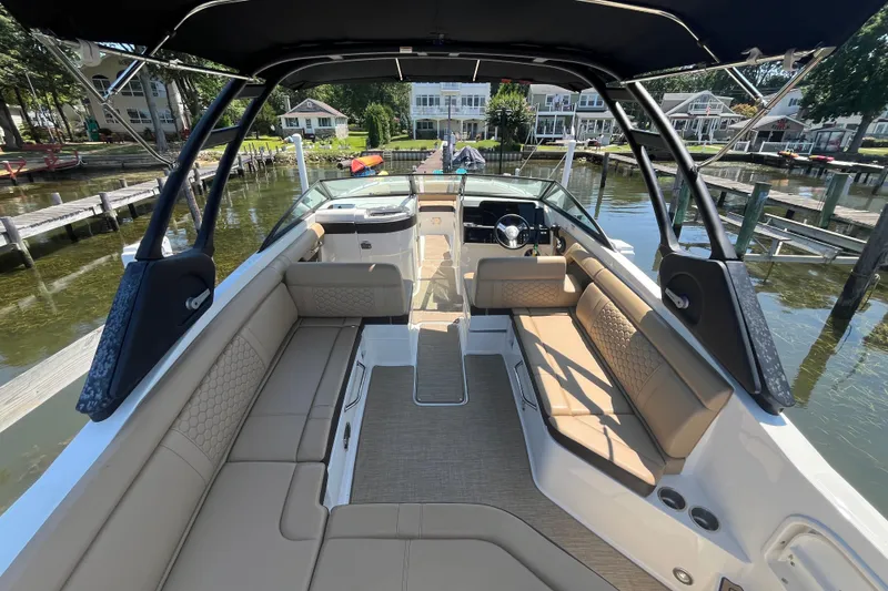 Slide: The Image of 2021 Sea Ray SDX 270 Outboard boat interior with spacious seating and elegant design. - 7