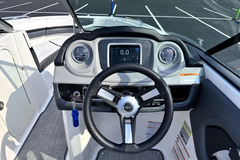 Slide: The Image of 2019 Chaparral Vortex 203 VRX boat dashboard with steering wheel and gauges. - 10