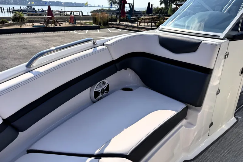 Slide: The Image of 2019 Chaparral Vortex 203 VRX boat interior with cushioned seating and speaker. - 13