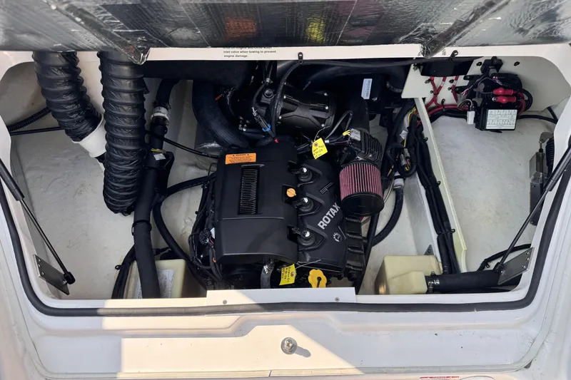 Slide: The Image of Engine compartment of 2019 Chaparral Vortex 203 VRX boat, featuring Rotax engine components. - 22