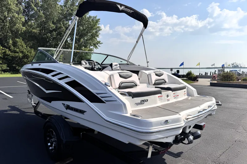 Slide: The Image of 2019 Chaparral Vortex 203 VRX boat parked near a scenic waterfront. - 3