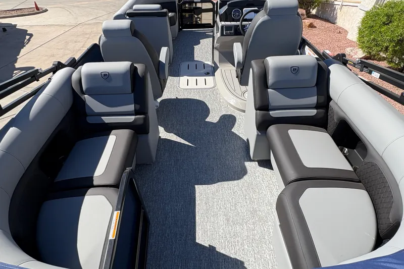 Slide: The Image of 2026 Premier 210 Sunsation RF pontoon boat interior with luxurious seating and modern design. - 11