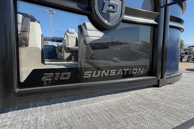 Slide: The Image of 2026 Premier 210 Sunsation RF pontoon boat with sleek design and comfortable seating. - 13