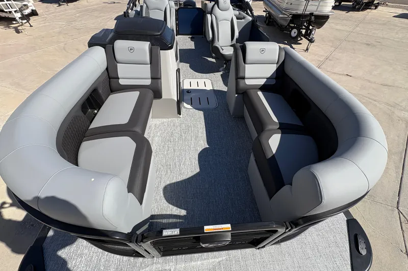 Slide: The Image of 2026 Premier 210 Sunsation RF pontoon boat interior with gray seating and spacious layout. - 5