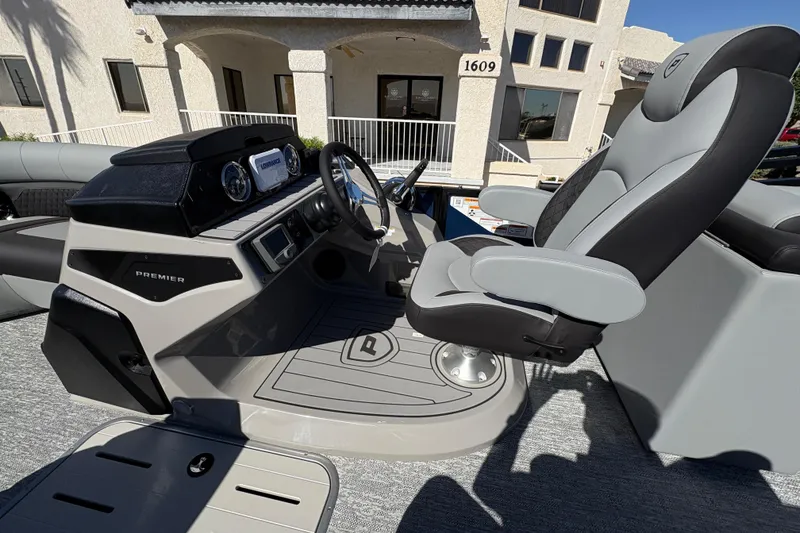 Slide: The Image of 2026 Premier 210 Sunsation RF boat interior with modern helm and comfortable seating. - 8
