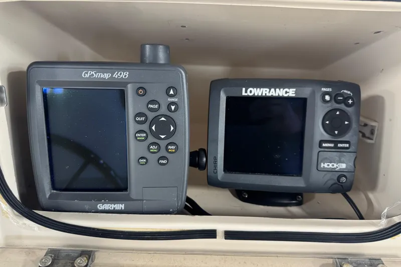 Slide: The Image of Garmin GPSmap 498 and Lowrance Hook 5 fish finders on Grady-White Fisherman 180, 2000 model. - 14