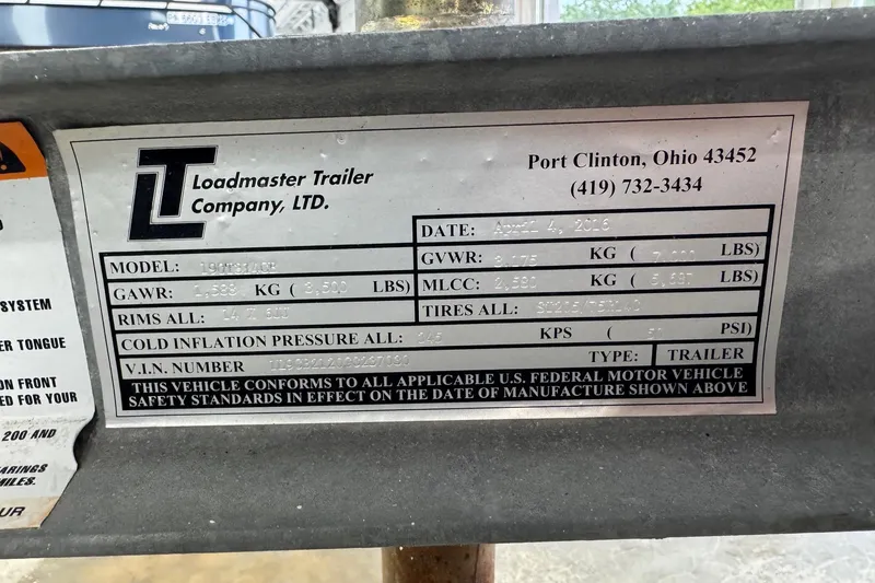 Slide: The Image of Label on Loadmaster Trailer, detailing specifications and compliance information. - 18