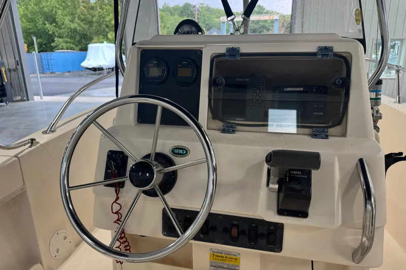 Slide: The Image of Grady-White Fisherman 180 boat console with steering wheel and navigation equipment, 2000 model. - 6