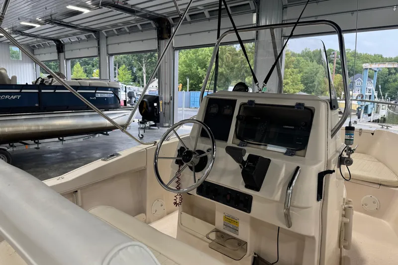 Slide: The Image of 2000 Grady-White Fisherman 180 boat interior with steering wheel and control panel. - 8