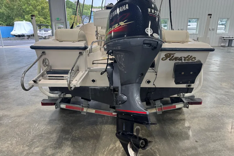 Slide: The Image of 2000 Grady-White Fisherman 180 boat with Yamaha 115 outboard motor in a garage. - 9