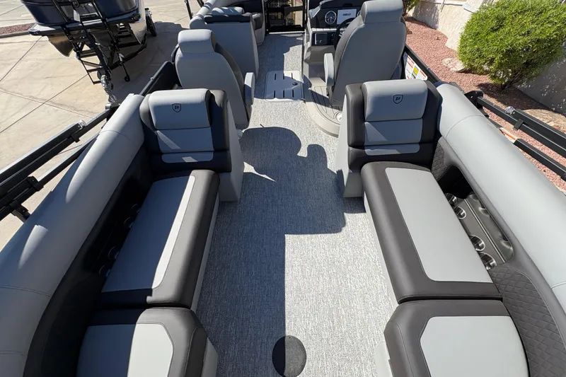 Slide: The Image of 2026 Premier 230 SunSation RF pontoon boat interior with luxurious seating and modern design. - 13