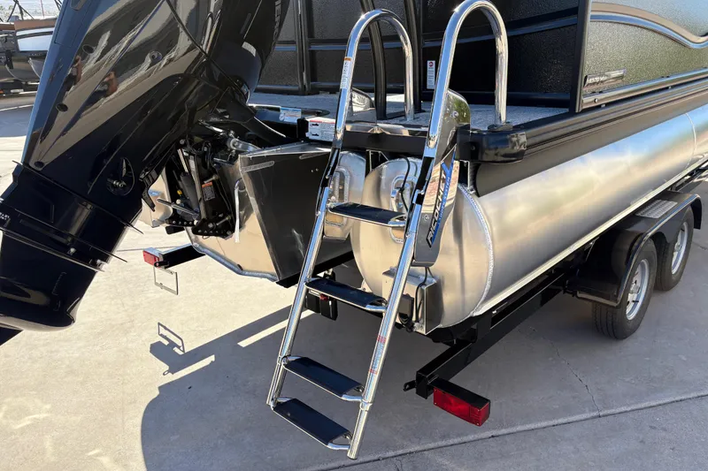 Slide: The Image of 2026 Premier 230 SunSation RF pontoon boat with ladder and outboard motor. - 14